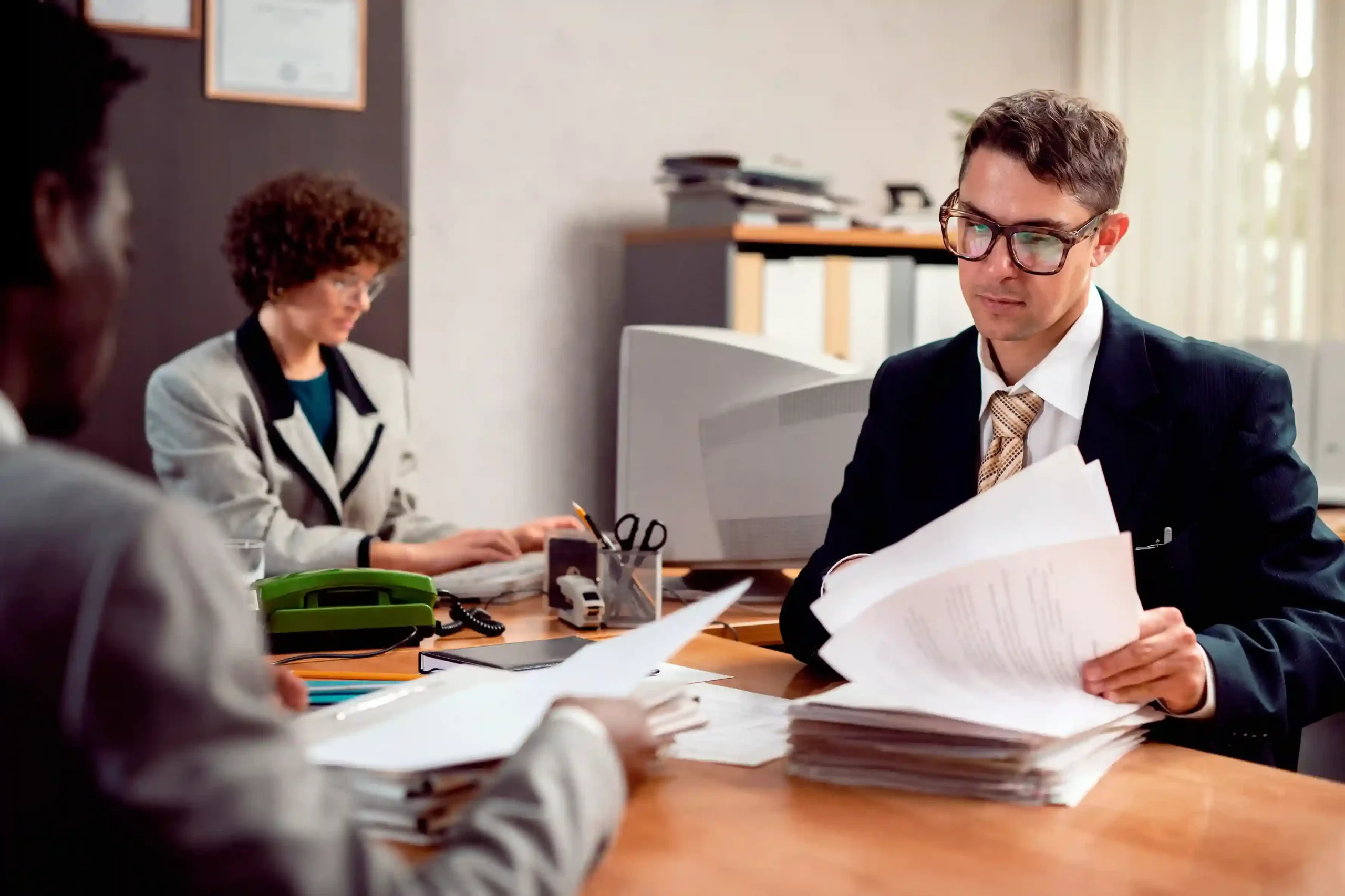 personal injury lawyer helping accident victim in office